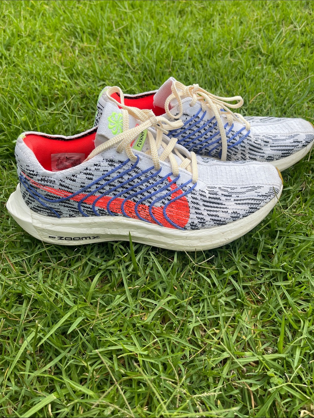 Nike White Knit Running Shoes with Orange & Blue Accents